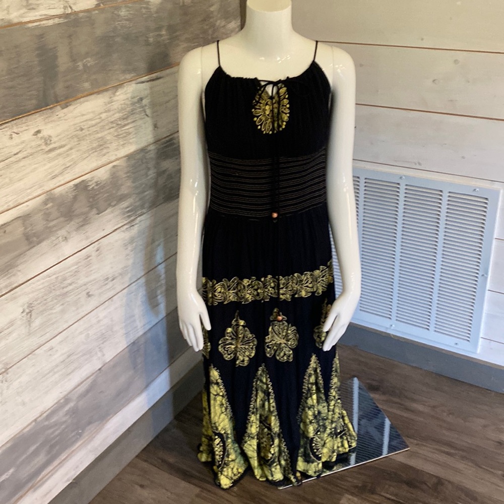 Adjustable dress by black strap that can be let out or taken in. NWOT